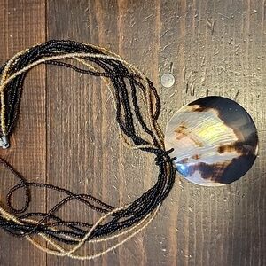 Bead necklace with shell pendant